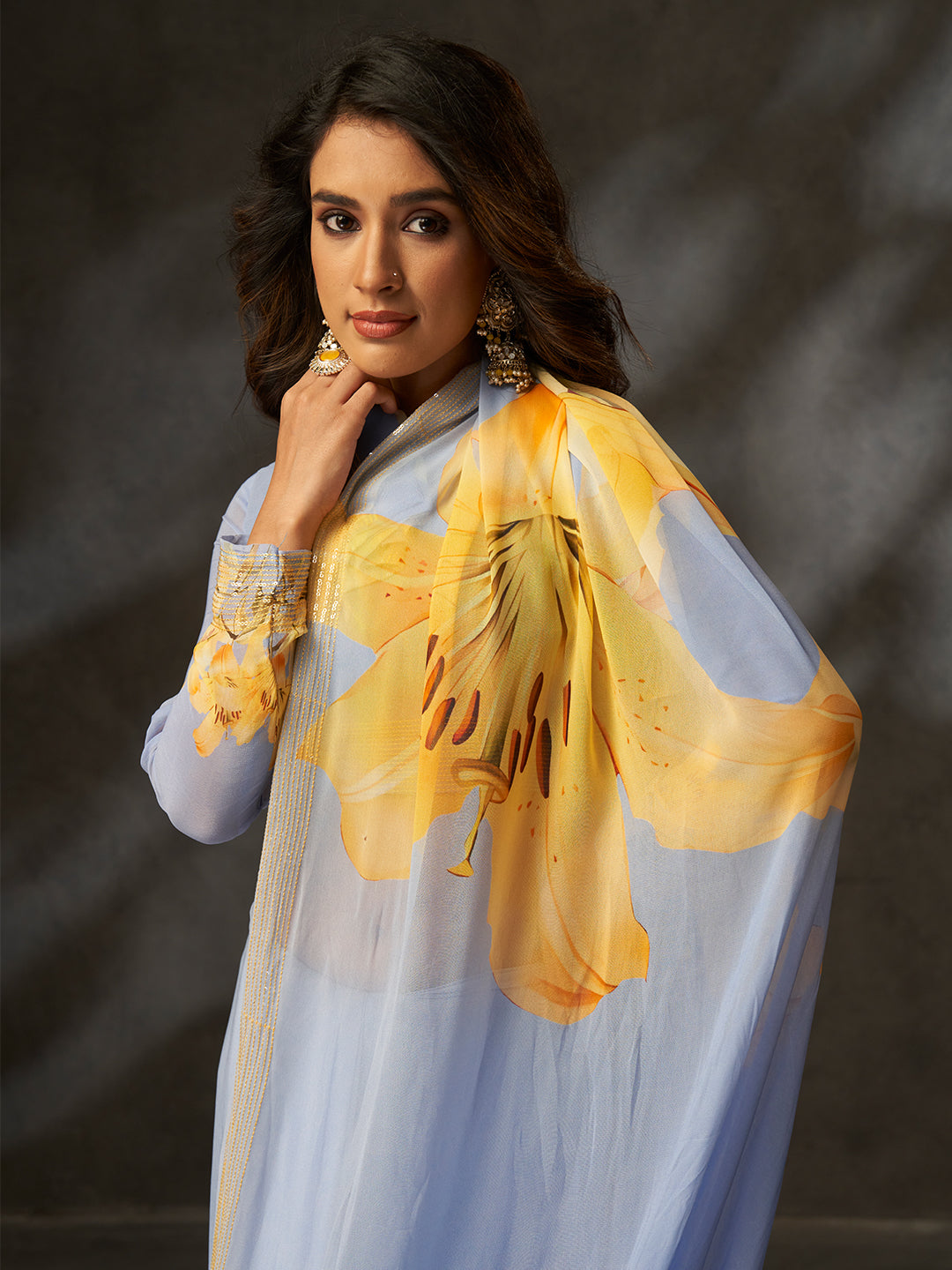 The delicate floral print combined with a subtle shimmering border