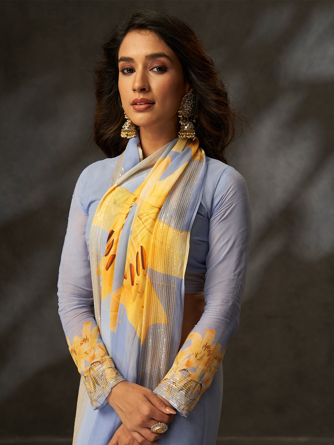 The delicate floral print combined with a subtle shimmering border